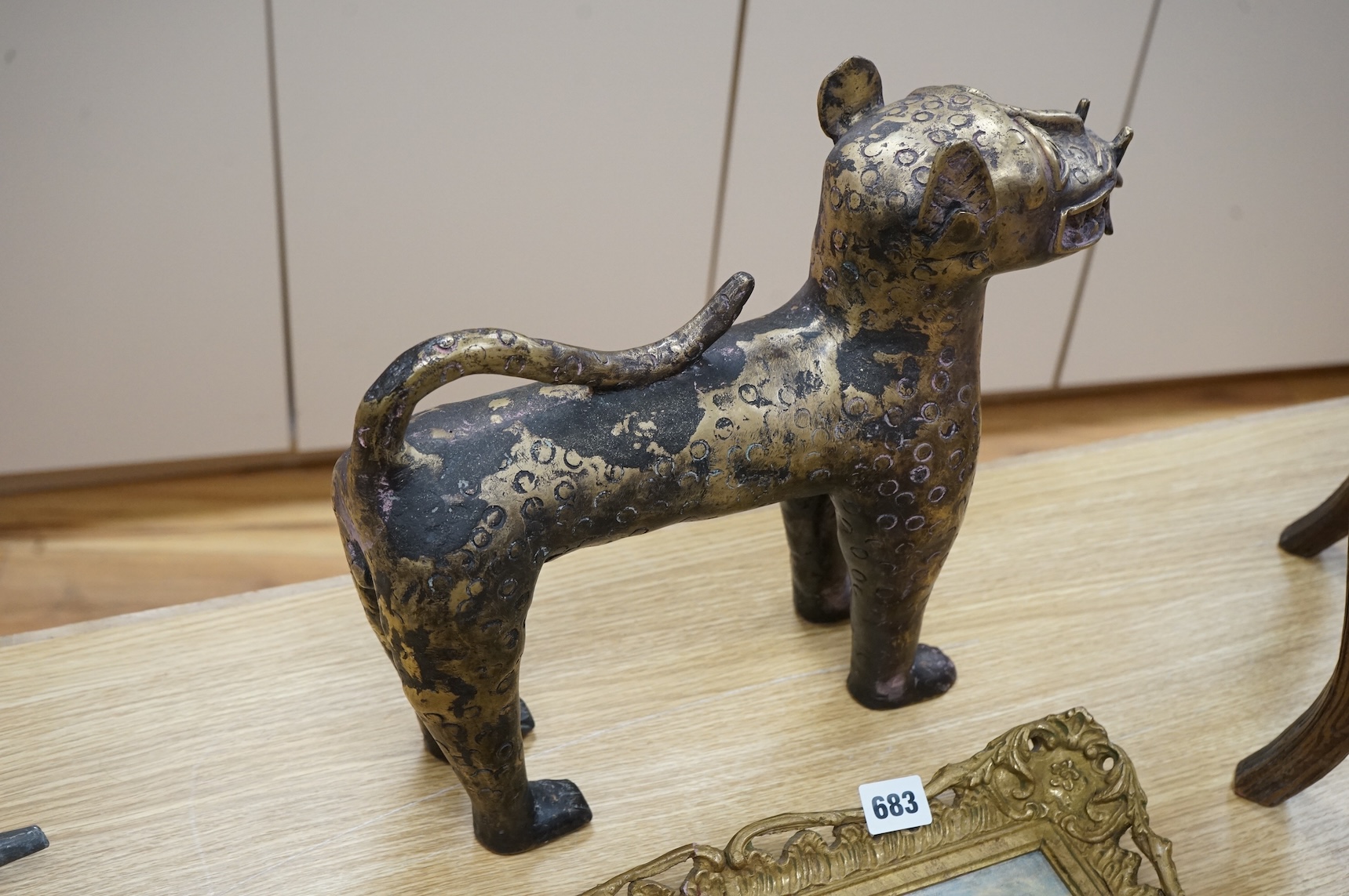 An African Benin style bronze model of a leopard, 37cm x 33cm